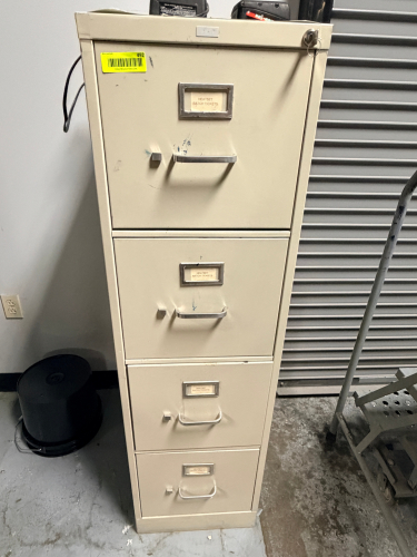 FOUR DRAWER FILE CABINET W/ LOCK AND KEY.