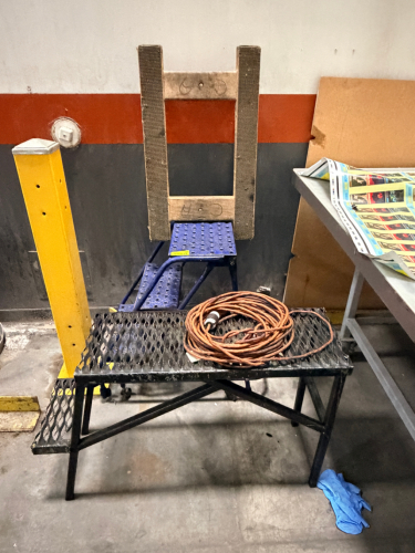 (2) METAL STAIR / STOOLS, (1) 4 WAY DOLLY, AND (1) EXTENSION CORD.