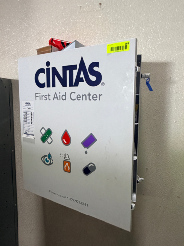 WALL MOUNTED FIRST AID CABINET.