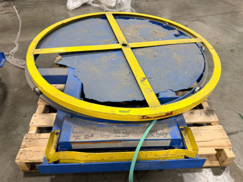 PNEUMATIC ROTARY TURNTABLE WITH LOW-PROFILE BASE, HEAVY-DUTY STEEL ROTATING PLATFORM, AND INTEGRATED AIR CYLINDER.
