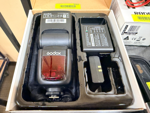 GODOX V860IIC TTL LI-ION CAMERA FLASH KIT WITH RECHARGEABLE BATTERY, BATTERY CHARGER, AND ORIGINAL FACTORY PACKAGING.