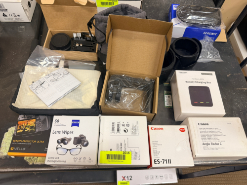 ASSORTED CAMERA AND PHOTOGRAPHY ACCESSORIES INCLUDING CAMERA CAGE, CARRYING CASE, SCREEN PROTECTOR, LENS WIPES, LENS HOOD, ANGLE FINDER, BATTERY CHARGING BOX, LENS ADAPTER, AND ASSORTED ACCESSORIES.
