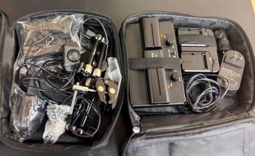LED VIDEO LIGHTING KIT WITH ACCESSORIES. LOT INCLUDES (2) BI-COLOR LED PANEL LIGHTS, (2) BATTERY MOUNTS, POWER ADAPTER, ARTICULATING MOUNTING ARMS, SUPER CLAMPS, REMOTE DIMMER, CABLES, AND CARRYING CASES.