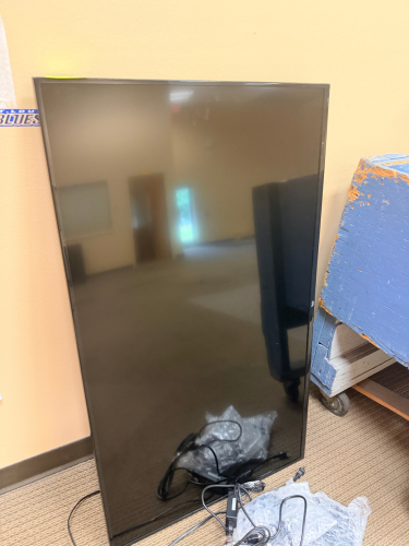 50" CLASS FIRE TV SMART LED TELEVISION WITH WALL MOUNT AND REMOTE.