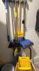 (1) LOT OF ASSORTED MOPS, BROOMS, AND MOP BUCKETS AS SHOWN