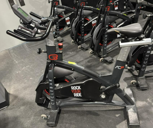 (1) SCHWINN AC PERFORMANCE PLUS INDOOR CYCLE WITH 2 WEIGHTED BARS, MISSING PEDALS
