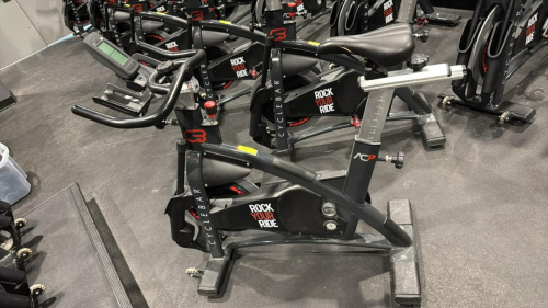 (1) SCHWINN AC PERFORMANCE PLUS INDOOR CYCLE WITH 2 WEIGHTED BARS HAS MISSING PARTS