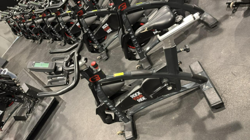 (1) SCHWINN AC PERFORMANCE PLUS INDOOR CYCLE WITH 2 WEIGHTED BARS, MISSING PEDALS