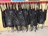 (1) LARGE LOT OF PAINTING APRONS WITH HANGING RACK