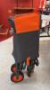 (1) ORANGE WAGON WITH COVER