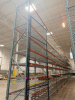 (17) SECTIONS OF 25 FT TALL UPRIGHTS, 42 IN DEEP, AND 8 FT LONG CROSS BEAMS OF TEAR DROP PALLET RACKING WITH WIRE DECKING. INCLUDES (18) UPRIGHTS, ORANGE STEP BEAMS, GREEN UPRIGHTS, WIRE DECKS, END CAP CHAIN LINK SAFETY CAGES WITH ACCESS GATE, AND CARGO N
