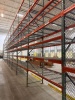 (17) SECTIONS OF 25 FT TALL UPRIGHTS, 42 IN DEEP, AND 8 FT LONG CROSS BEAMS OF TEAR DROP PALLET RACKING WITH WIRE DECKING. INCLUDES (18) UPRIGHTS, ORANGE STEP BEAMS, GREEN UPRIGHTS, WIRE DECKS, END CAP CHAIN LINK SAFETY CAGES WITH ACCESS GATE, AND CARGO N - 7