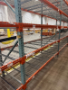 (17) SECTIONS OF 25 FT TALL UPRIGHTS, 42 IN DEEP, AND 8 FT LONG CROSS BEAMS OF TEAR DROP PALLET RACKING WITH WIRE DECKING. INCLUDES (18) UPRIGHTS, ORANGE STEP BEAMS, GREEN UPRIGHTS, WIRE DECKS, END CAP CHAIN LINK SAFETY CAGES WITH ACCESS GATE, AND CARGO N - 8