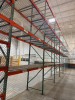 (17) SECTIONS OF 25 FT TALL UPRIGHTS, 42 IN DEEP, AND 8 FT LONG CROSS BEAMS OF TEAR DROP PALLET RACKING WITH WIRE DECKING. INCLUDES (18) UPRIGHTS, ORANGE STEP BEAMS, GREEN UPRIGHTS, WIRE DECKS, END CAP CHAIN LINK SAFETY CAGES WITH ACCESS GATE, AND CARGO N - 9