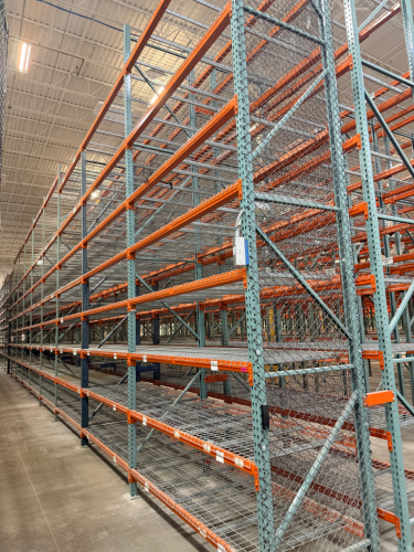 (34) SECTIONS OF 25 FT TALL UPRIGHTS AND 8 FT LONG CROSS BEAMS OF TEAR DROP PALLET RACKING. CONFIGURED AS (2) BACK-TO-BACK RUNS OF (17) SECTIONS EACH. INCLUDES (36) UPRIGHTS, ORANGE STEP BEAMS, GREEN UPRIGHTS, HEAVY-DUTY WIRE DECKING, AND STABILIZING TIE 