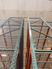 (34) SECTIONS OF 25 FT TALL UPRIGHTS AND 8 FT LONG CROSS BEAMS OF TEAR DROP PALLET RACKING. CONFIGURED AS (2) BACK-TO-BACK RUNS OF (17) SECTIONS EACH. INCLUDES (36) UPRIGHTS, ORANGE STEP BEAMS, GREEN UPRIGHTS, HEAVY-DUTY WIRE DECKING, AND STABILIZING TIE - 3