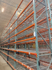 (34) SECTIONS OF 25 FT TALL UPRIGHTS AND 8 FT LONG CROSS BEAMS OF TEAR DROP PALLET RACKING. CONFIGURED AS (2) BACK-TO-BACK RUNS OF (17) SECTIONS EACH. INCLUDES (36) UPRIGHTS, ORANGE STEP BEAMS, GREEN UPRIGHTS, HEAVY-DUTY WIRE DECKING, AND STABILIZING TIE - 4