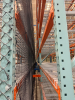 (34) SECTIONS OF 25 FT TALL UPRIGHTS AND 8 FT LONG CROSS BEAMS OF TEAR DROP PALLET RACKING. CONFIGURED AS (2) BACK-TO-BACK RUNS OF (17) SECTIONS EACH. INCLUDES (36) UPRIGHTS, ORANGE STEP BEAMS, GREEN UPRIGHTS, HEAVY-DUTY WIRE DECKING, AND STABILIZING TIE - 13