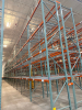 (34) SECTIONS OF 25 FT TALL UPRIGHTS AND 8 FT LONG CROSS BEAMS OF TEAR DROP PALLET RACKING. CONFIGURED AS (2) BACK-TO-BACK RUNS OF (17) SECTIONS EACH. INCLUDES (36) UPRIGHTS, ORANGE STEP BEAMS, GREEN UPRIGHTS, HEAVY-DUTY WIRE DECKING, AND STABILIZING TIE - 2