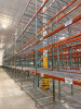 (34) SECTIONS OF 25 FT TALL UPRIGHTS AND 8 FT LONG CROSS BEAMS OF TEAR DROP PALLET RACKING. CONFIGURED AS (2) BACK-TO-BACK RUNS OF (17) SECTIONS EACH. INCLUDES (36) UPRIGHTS, ORANGE STEP BEAMS, GREEN UPRIGHTS, HEAVY-DUTY WIRE DECKING, AND STABILIZING TIE - 3