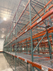 (34) SECTIONS OF 25 FT TALL UPRIGHTS AND 8 FT LONG CROSS BEAMS OF TEAR DROP PALLET RACKING. CONFIGURED AS (2) BACK-TO-BACK RUNS OF (17) SECTIONS EACH. INCLUDES (36) UPRIGHTS, ORANGE STEP BEAMS, GREEN UPRIGHTS, HEAVY-DUTY WIRE DECKING, AND STABILIZING TIE - 9