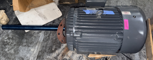 HEAVY-DUTY INDUSTRIAL ELECTRIC MOTOR WITH EXTRA-LONG EXTENDED SHAFT, FLANGE MOUNT, AND CAST IRON TEFC CONSTRUCTION. MOTOR FEATURES A LIFTING EYE AND TOP-MOUNTED TERMINAL BOX.