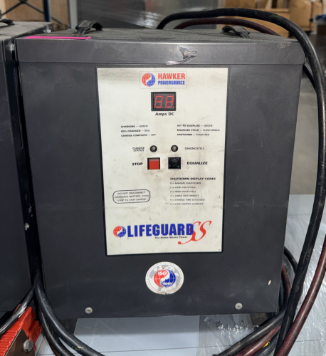 INDUSTRIAL SMART BATTERY CHARGER WITH DIGITAL DISPLAY, PUSH-BUTTON CONTROLS, AND STEEL FLOOR-MOUNT CABINET.