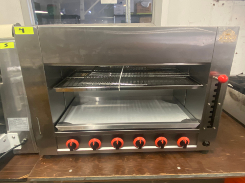 KAESIDL GAS SALAMANDER BROILER WITH SIX INDEPENDENT BURNER CONTROLS, HEIGHT-ADJUSTABLE COOKING RACK, REMOVABLE DRIP TRAY, AND CHROME-PLATED COOKING GRATES.