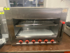 KAESIDL GAS SALAMANDER BROILER WITH SIX INDEPENDENT BURNER CONTROLS, HEIGHT-ADJUSTABLE COOKING RACK, REMOVABLE DRIP TRAY, AND CHROME-PLATED COOKING GRATES.