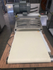 STAINLESS STEEL ELECTRIC TABLETOP DOUGH SHEETER WITH REVERSIBLE CONVEYOR BELTS, ADJUSTABLE ROLLER THICKNESS, EMERGENCY STOP BUTTON, AND FOLDING CONVEYOR TABLES. - 6