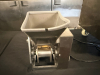 STAINLESS STEEL ELECTRIC AUTOMATIC DUMPLING / RAVIOLI FORMING MACHINE WITH STUFFING HOPPER, DOUGH HOPPER, FORMING ROLLER ASSEMBLY, CONVEYOR DISCHARGE, AND LOCKING SWIVEL CASTERS. UNIT FEATURES ADJUSTABLE STUFFING VOLUME CONTROL. - 7