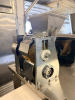 STAINLESS STEEL ELECTRIC AUTOMATIC DUMPLING / RAVIOLI FORMING MACHINE WITH STUFFING HOPPER, DOUGH HOPPER, FORMING ROLLER ASSEMBLY, CONVEYOR DISCHARGE, AND LOCKING SWIVEL CASTERS. UNIT FEATURES ADJUSTABLE STUFFING VOLUME CONTROL. - 11
