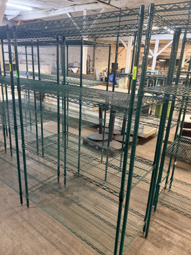 48" X 24" FOUR TIER POLY COATED WIRE SHELF.