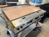 GARLAND COMMERCIAL GAS FLAT-TOP GRIDDLE WITH LARGE STEEL COOKING SURFACE, SIX FRONT-MOUNTED CONTROL KNOBS, MANUAL IGNITION CONTROLS, STAINLESS STEEL FRONT AND SIDES, SPLASH GUARDS, AND FRONT GREASE DRAWERS. - 3