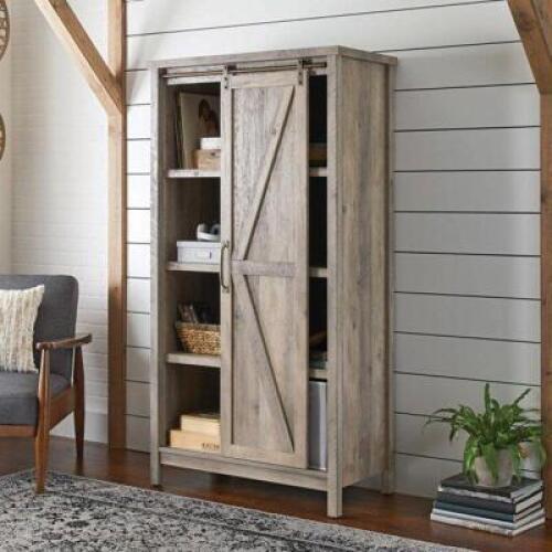 DESCRIPTION: (1) MODERN FARMHOUSE BOOKCASE BRAND/MODEL: BETTER HOMES & GARDEN/421191 INFORMATION: RUSTIC GRAY/5-ADJUSTABLE SHELVES/SLIDING BARN-DOOR R
