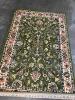 (1) GREEN AREA RUG
