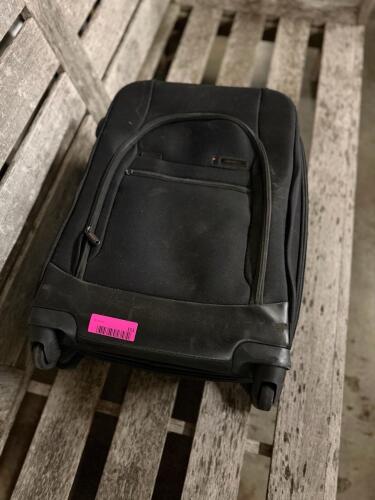 (1) BLACK ROLLING CARRY-ON SUITCASE