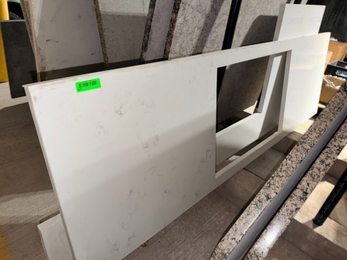 (2) PIECE WHITE ENGINEERED STONE / QUARTZ COUNTERTOP SET WITH SUBTLE LIGHT GRAY MARBLE-STYLE VEINING. INCLUDES A LARGE FABRICATED COUNTERTOP SECTION WITH RECTANGULAR CUTOUTS AND ONE ADDITIONAL MATCHING SLAB SECTION