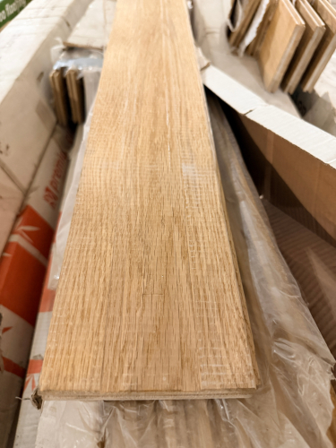 (4) NATURAL STRAND-WOVEN BAMBOO FLOORING CONSISTING OF SOLID LOCKING PLANKS WITH A LIGHT NATURAL WOOD FINISH.