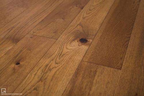 (10) BOXES OF TIMBERLAND ENGINEERED OAK HARDWOOD FLOORING WITH A MEDIUM-TO-DARK BROWN WOOD-GRAIN FINISH AND TONGUE-AND-GROOVE EDGE PROFILE.
