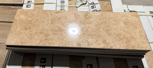 (18) CASES OF EMPORADOR IVORY RECTANGULAR CERAMIC/PORCELAIN TILE WITH A TAN AND IVORY STONE-LOOK PATTERN AND GLOSSY FINISH.