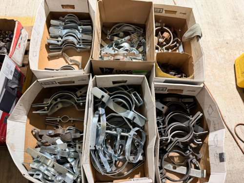 (1) PALLET OF HEAVY-DUTY METAL PIPE HANGERS, RISER CLAMPS, CLEVIS-STYLE HANGERS, PIPE SUPPORT BRACKETS, U-BOLT ASSEMBLIES, STRAPS, AND RELATED MOUNTING HARDWARE. INCLUDES ASSORTED SIZES AND CONFIGURATIONS WITH GALVANIZED, ZINC-PLATED, AND PLAIN/BLACK STEE
