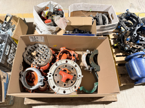 PALLET OF GROOVED PIPE FITTINGS, COUPLINGS, FLANGES, CAPS, STRAINERS, PIPE HANGERS, CLAMPS, AND RELATED PLUMBING/FIRE PROTECTION HARDWARE.