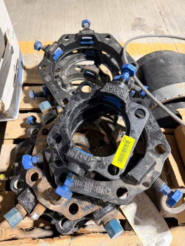 LOT OF SIGMA ONE-LOK SERIES MECHANICAL JOINT RESTRAINT GLANDS WITH DUCTILE IRON BODY, INTEGRAL RESTRAINT WEDGES, FLANGE BOLT HOLES, AND TORQUE-LIMITING BREAKAWAY BOLTS.