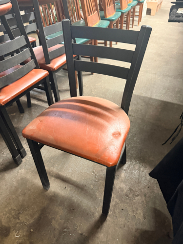 (6) LADDER BACK METAL CHAIRS W/ LIGHT ORANGE PADDED SEATS.
