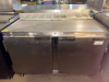 TWO-DOOR COMMERCIAL UNDERCOUNTER REFRIGERATOR WITH STAINLESS STEEL TOP, STAINLESS STEEL INTERIOR, TWO SOLID HINGED DOORS, WIRE SHELVING, REAR VENTILATION, AND CASTERS. - 2