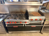 VULCAN NATURAL GAS RESTAURANT RANGE WITH SIX OPEN-TOP BURNERS, 24" GRIDDLE, TWO STANDARD OVEN BASES, HEAVY CAST-IRON BURNER GRATES, STAINLESS STEEL FRONT AND BACKSPLASH, RED BURNER CONTROLS, OVEN RACKS, AND DUAL OVEN DOORS. - 2