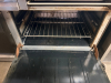 VULCAN NATURAL GAS RESTAURANT RANGE WITH SIX OPEN-TOP BURNERS, 24" GRIDDLE, TWO STANDARD OVEN BASES, HEAVY CAST-IRON BURNER GRATES, STAINLESS STEEL FRONT AND BACKSPLASH, RED BURNER CONTROLS, OVEN RACKS, AND DUAL OVEN DOORS. - 6