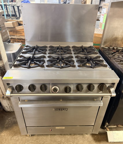 HOBART SIX-BURNER GAS RANGE WITH STANDARD OVEN BASE, HEAVY-DUTY CAST-IRON OPEN-TOP BURNER GRATES, STAINLESS STEEL FRONT, SIDES AND HIGH BACKSPLASH, INDIVIDUAL BURNER CONTROLS, OVEN TEMPERATURE CONTROL, AND REMOVABLE OVEN RACK SUPPORTS