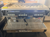 NUOVA TWO-GROUP AUTOMATIC ESPRESSO MACHINE WITH DUAL BREW GROUPS, PROGRAMMABLE VOLUMETRIC CONTROLS, STEAM WANDS, HOT-WATER DISPENSER, PRESSURE GAUGES, CUP-WARMING TOP, AND STAINLESS STEEL DRIP TRAY.
